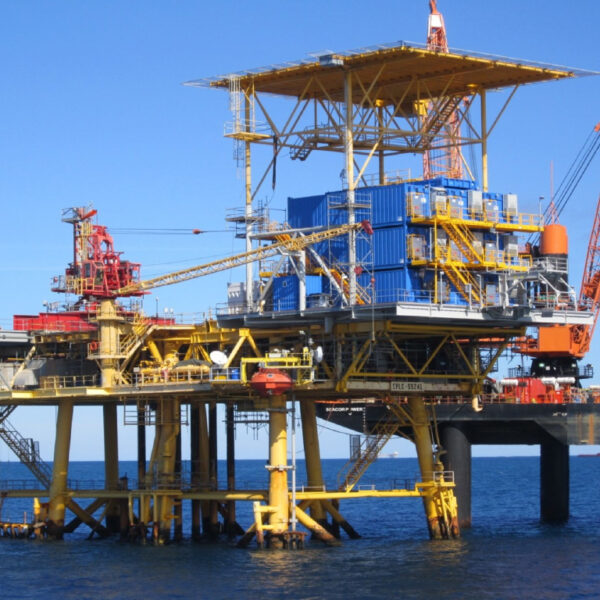An offshore platform with several stacked technical buildings, used for portable accommodations and work space.