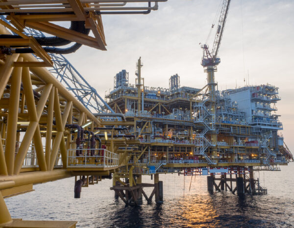 An offshore oil and gas facility with several connected platforms and integrated systems. 